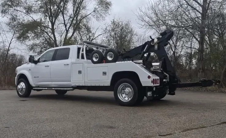 Washington wrecker equipment securing damaged vehicle
